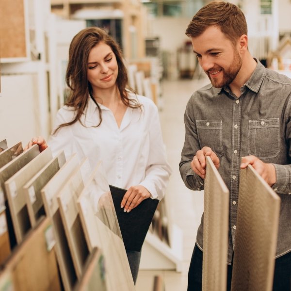 young couple looking at flooring samples at Eagle Flooring in Swansea, IL